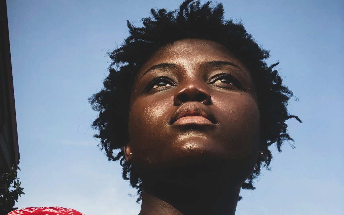 Young woman looking up at the sky